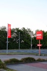 a few red banners on a street