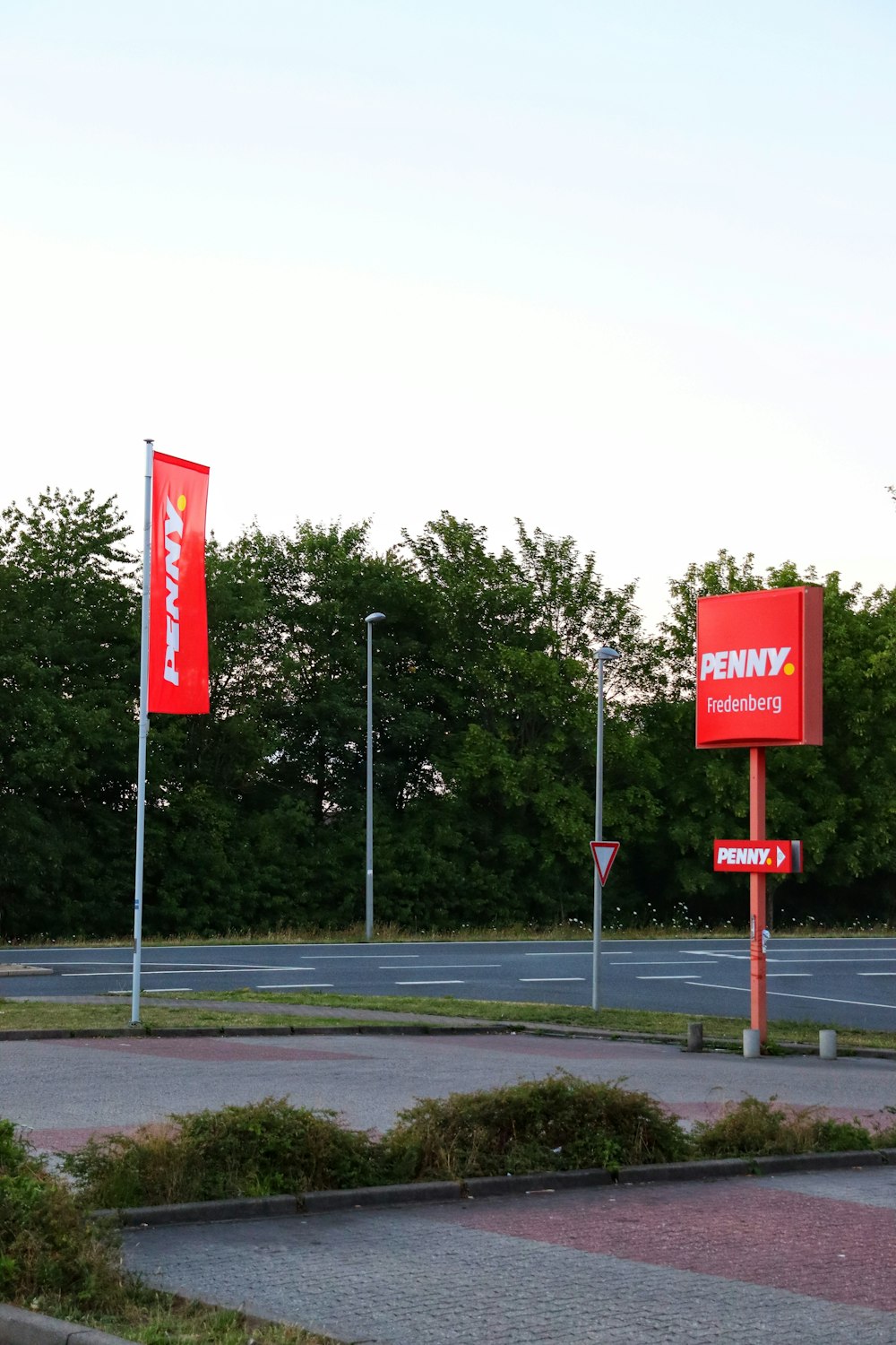 a few red banners on a street