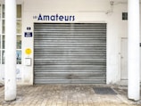 a garage door with a sign above it