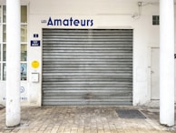 a garage door with a sign above it