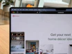 A cozy workspace showing a laptop open to verdeluxe's Pinterest board filled with lifestyle and accessory inspiration.