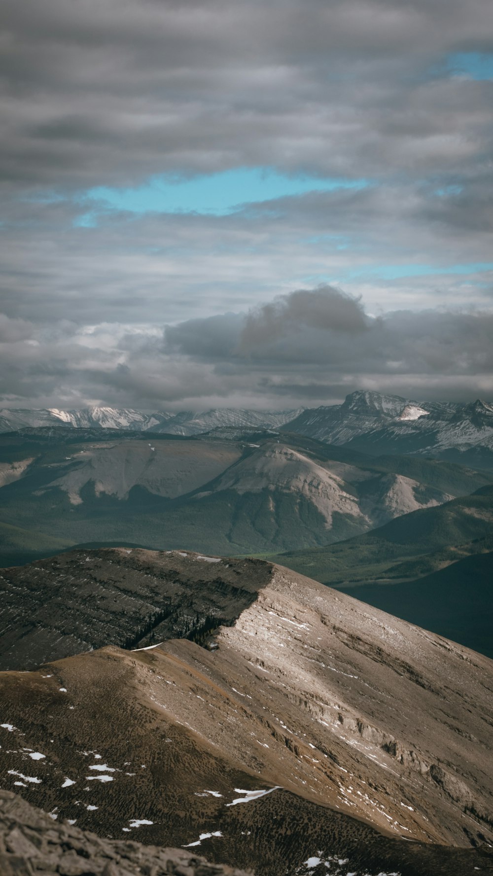 a mountain range with clouds