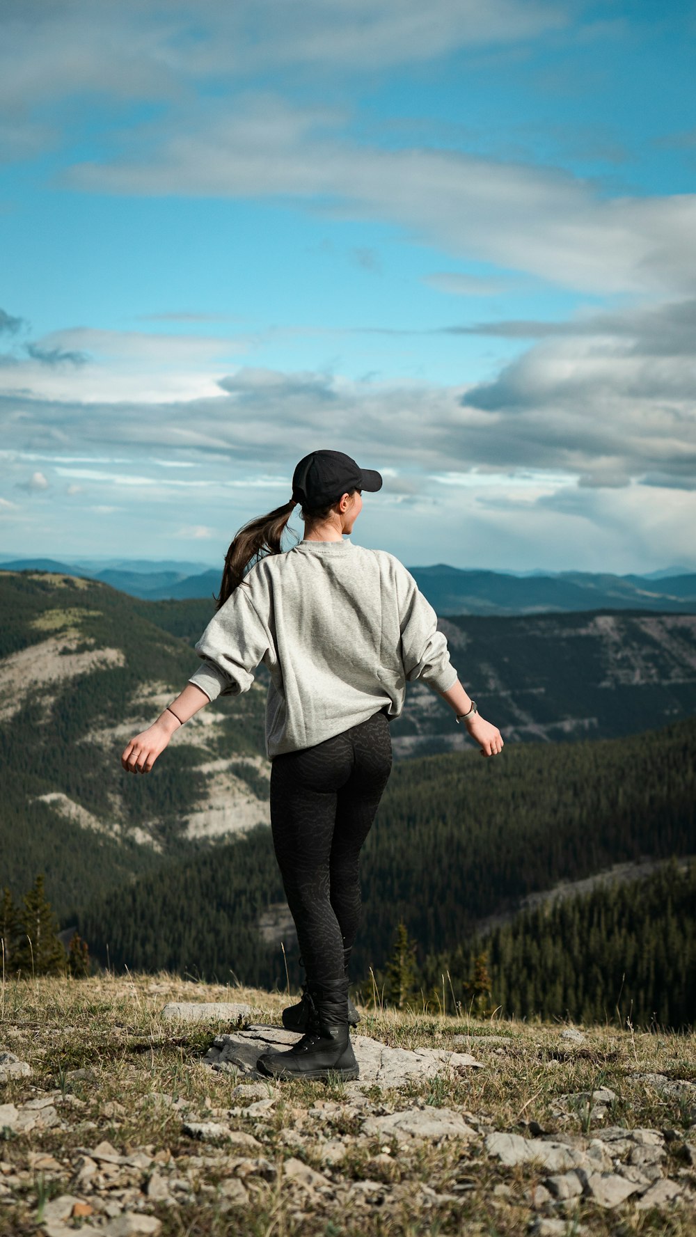 a man walking on a rocky hill