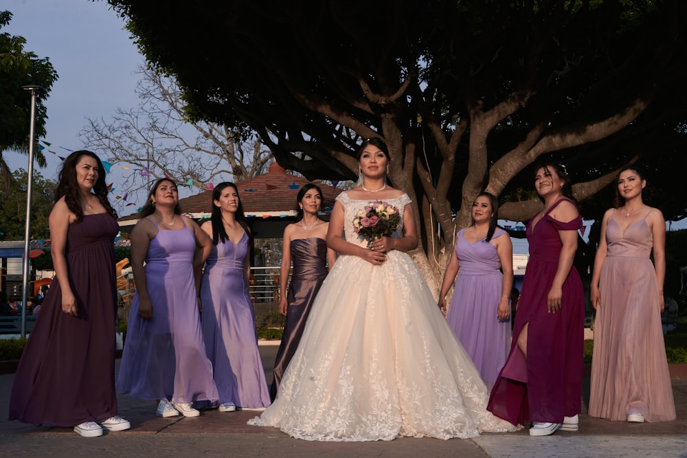 a group of women in dresses