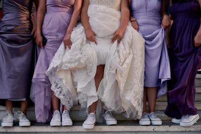 a group of people wearing dresses