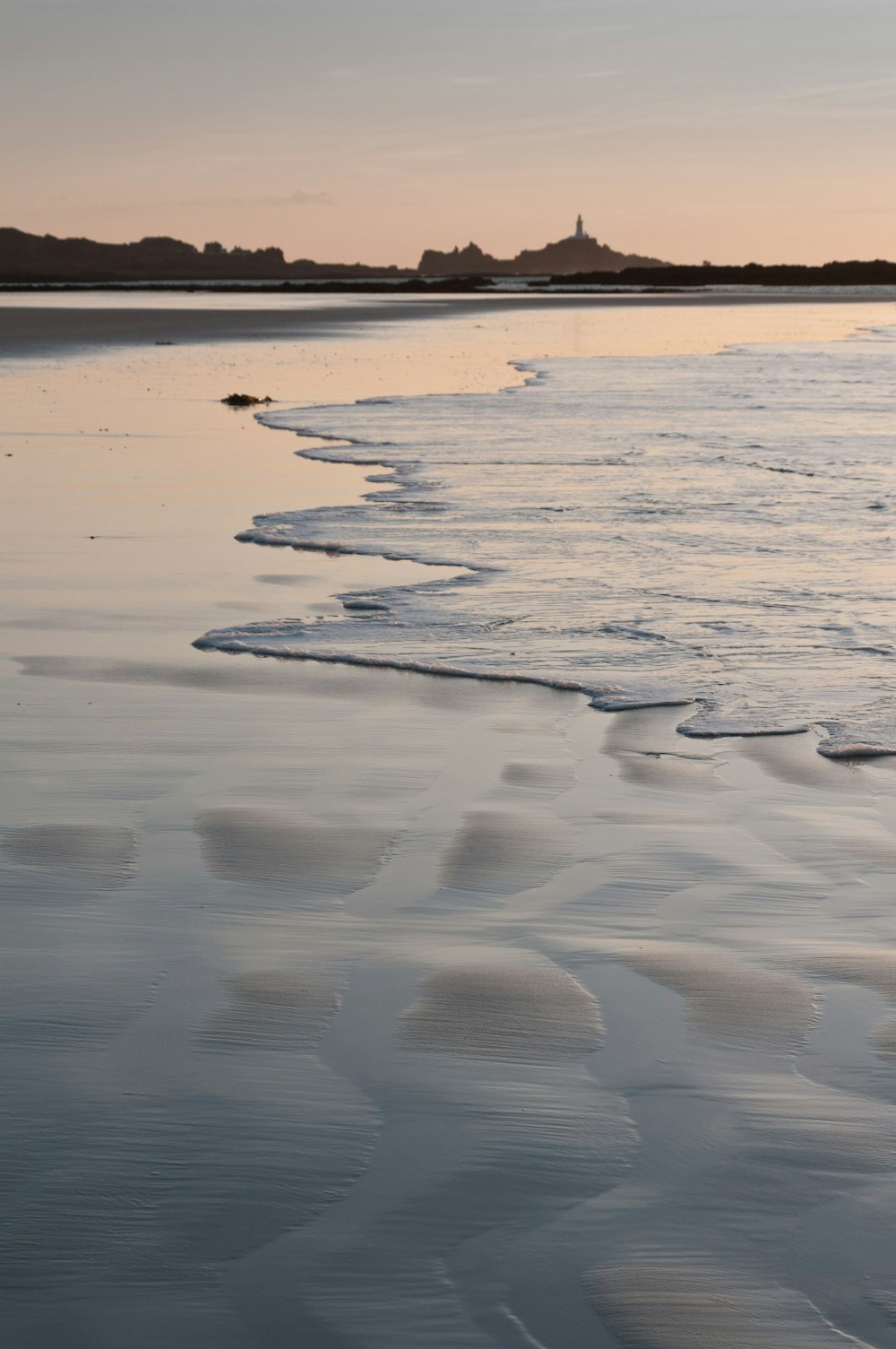 a body of water with ice and snow on it