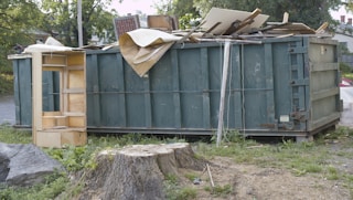 Dumpster full of trash from demolished building.