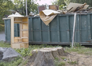 Dumpster full of trash from demolished building.