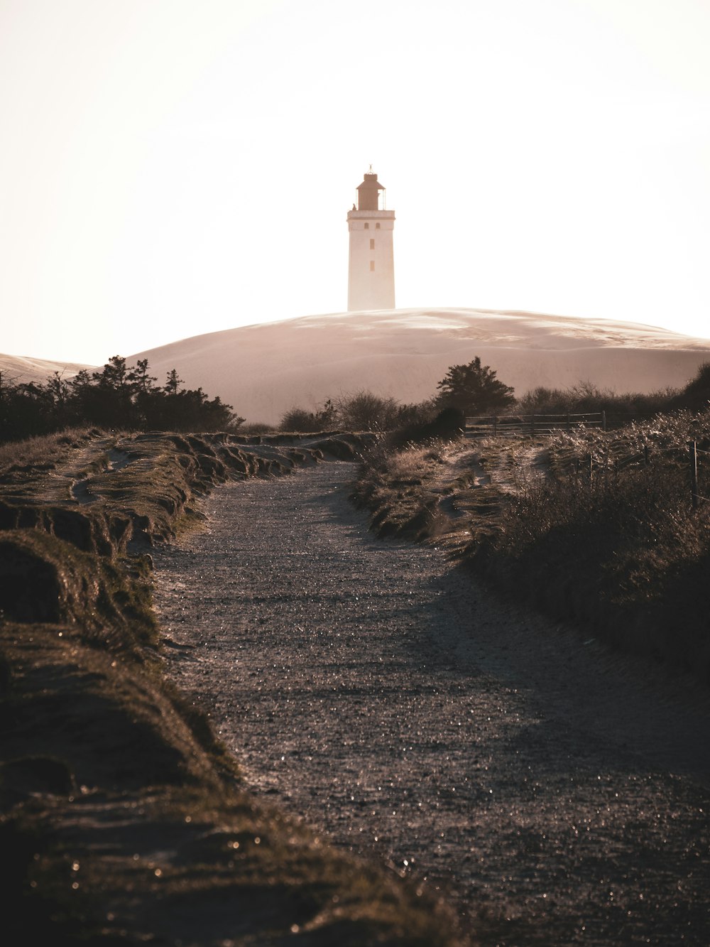 a lighthouse on a hill