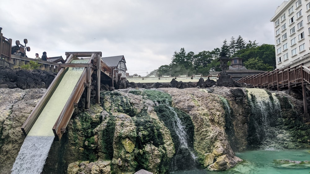 a bridge over a waterfall