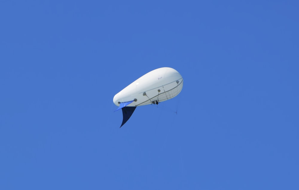 a person in the air with a parachute