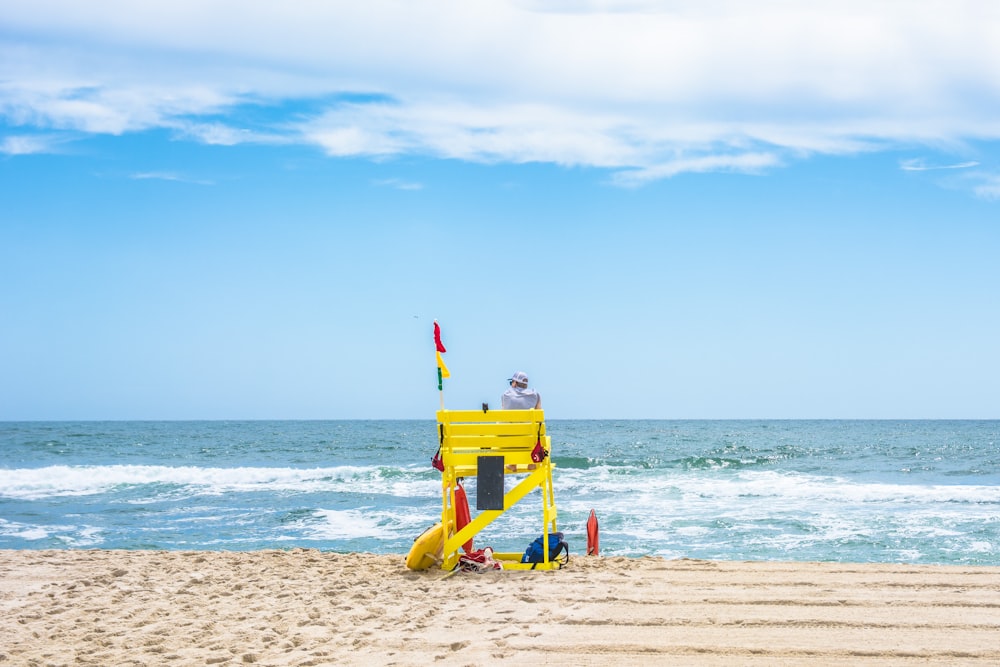 a person on a yellow machine on a beach