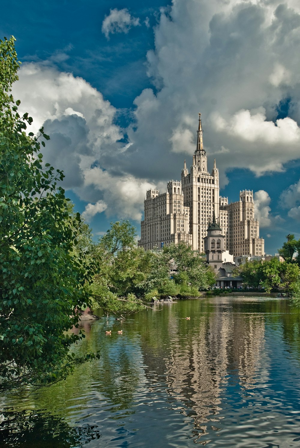 a castle on a hill by a river