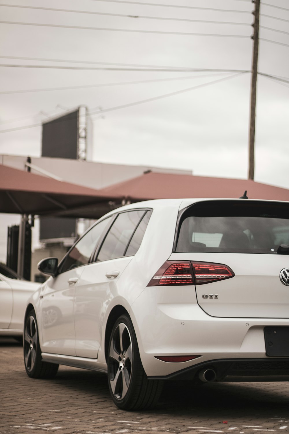 a white car parked in a parking lot