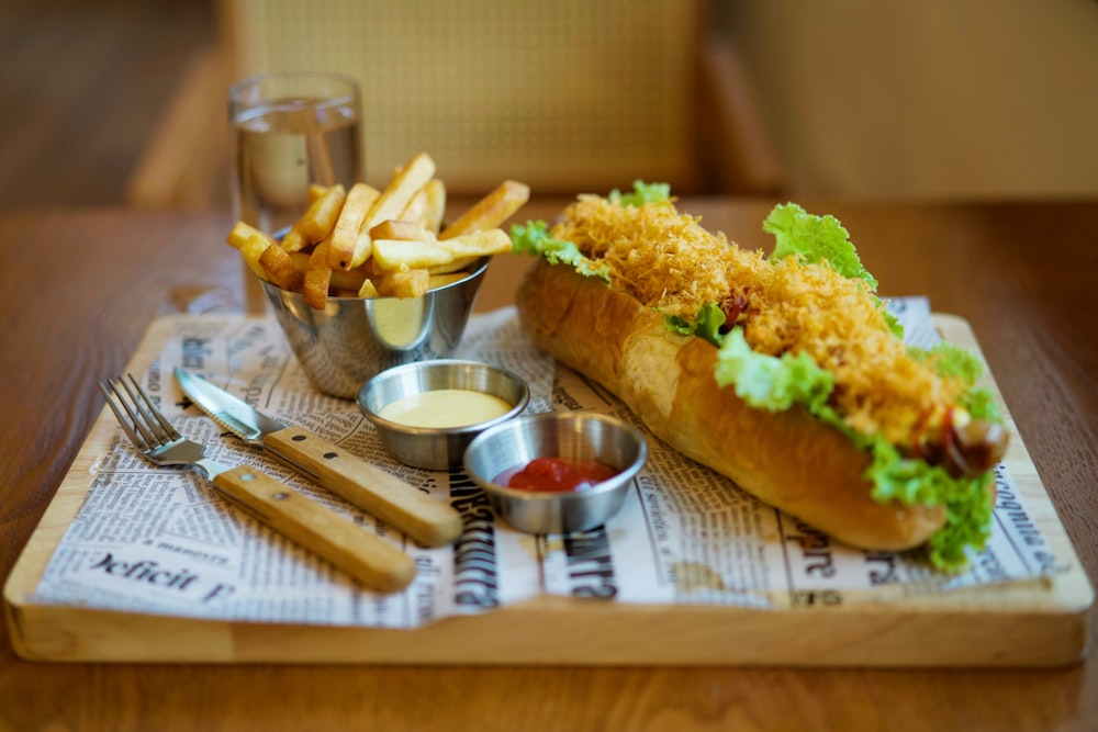 a sandwich and fries on a tray