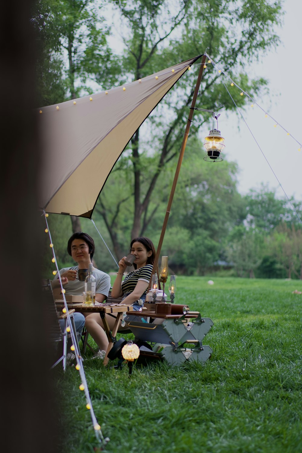 two women sitting in a hammock