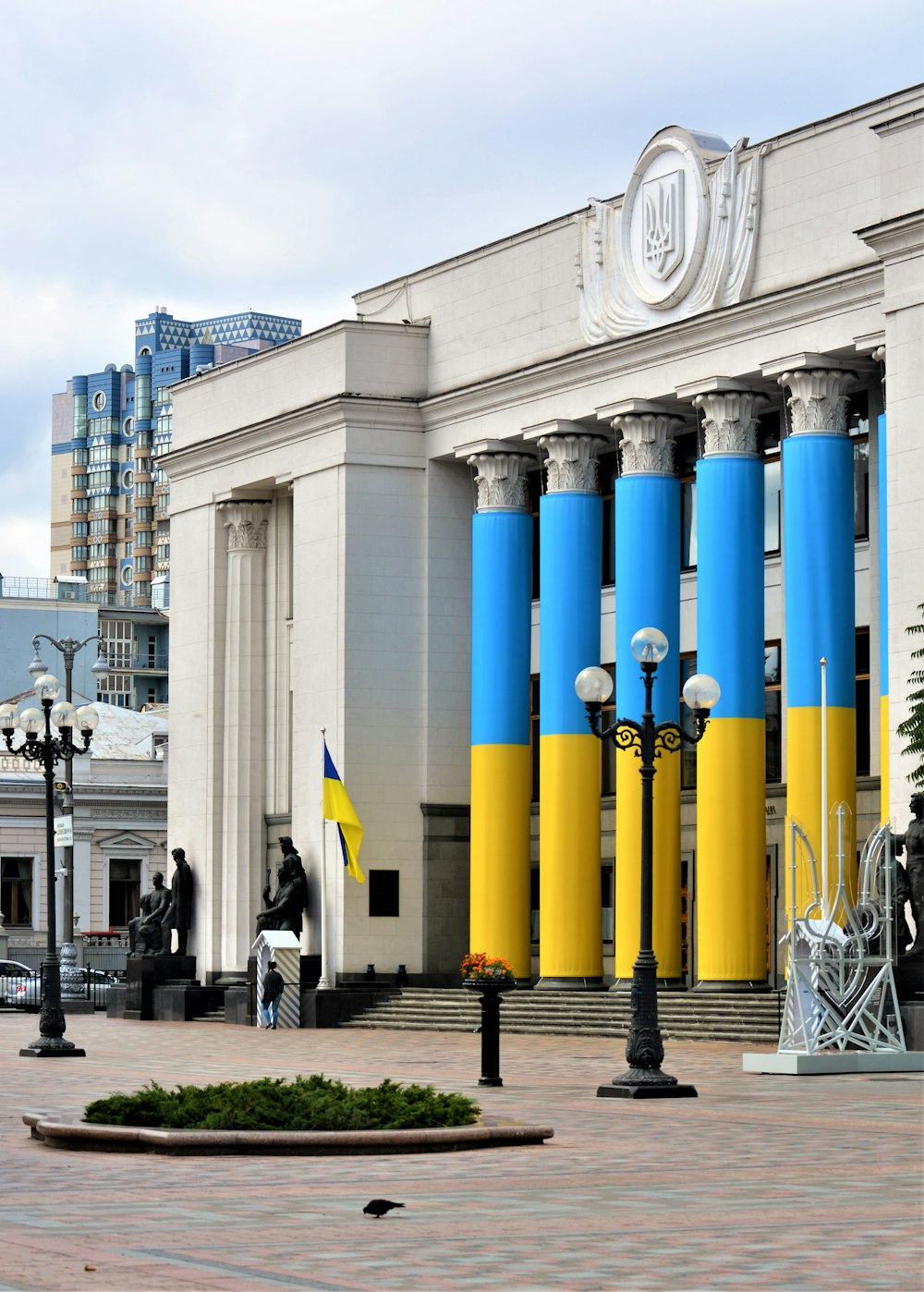 a building with blue pillars