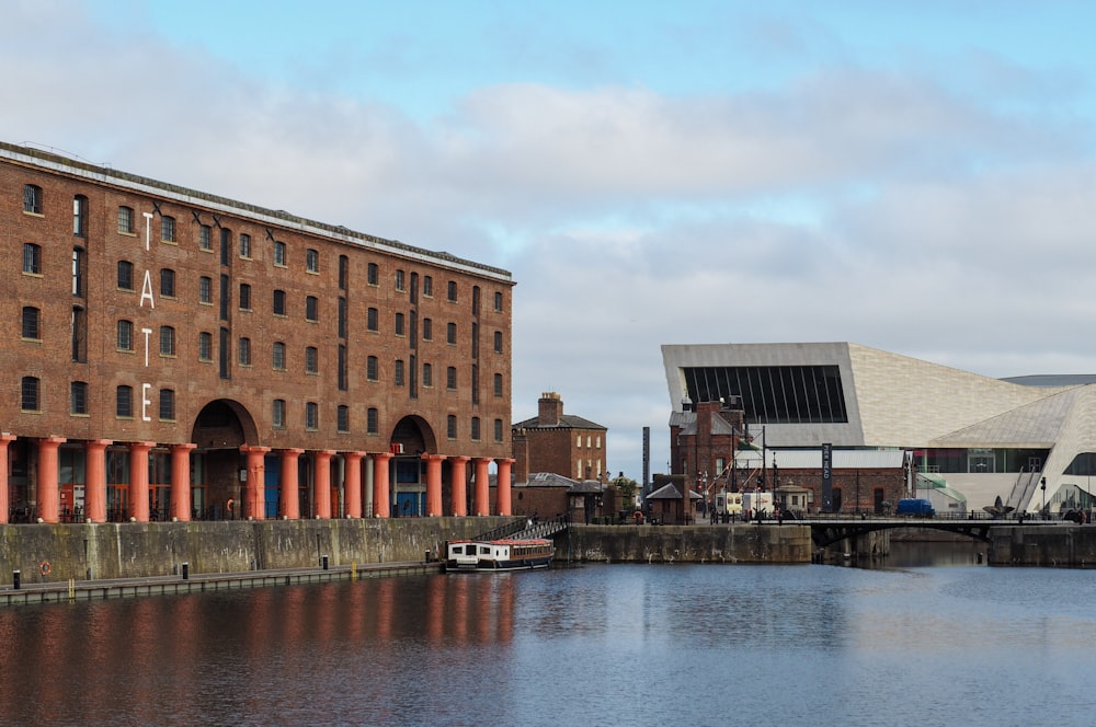 a body of water with buildings along it with Albert Dock in the background
