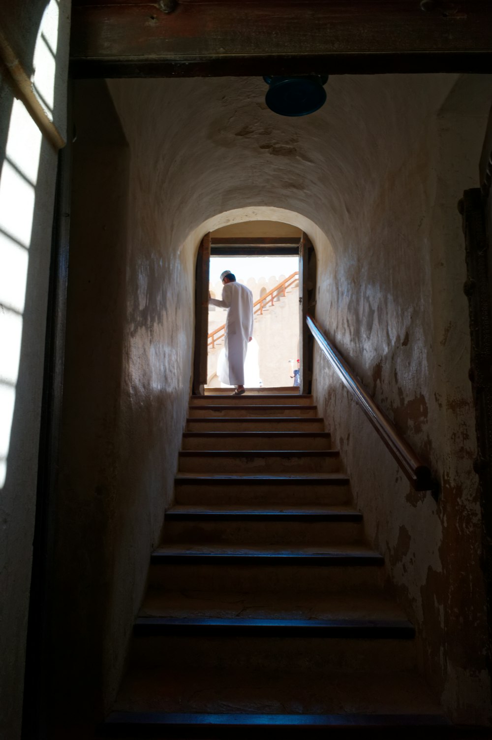 a person standing on a staircase