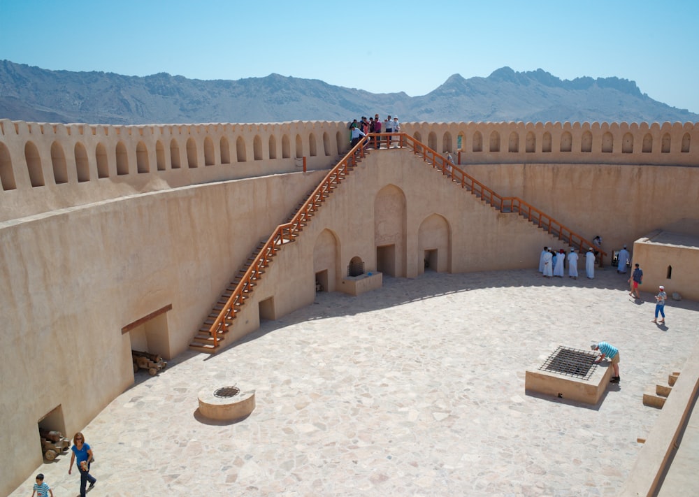 a large circular structure with people standing on it