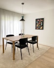 a dining room table with chairs