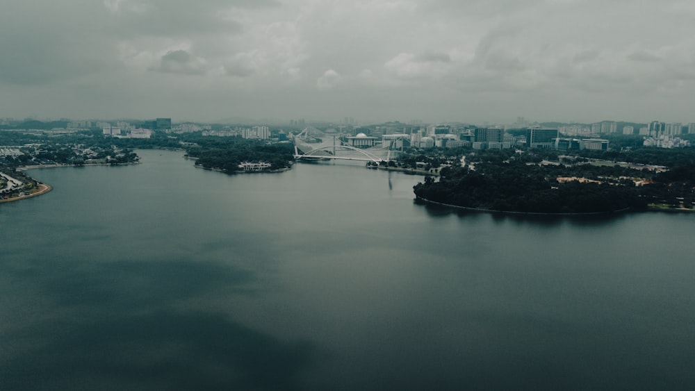 a body of water with a city in the background