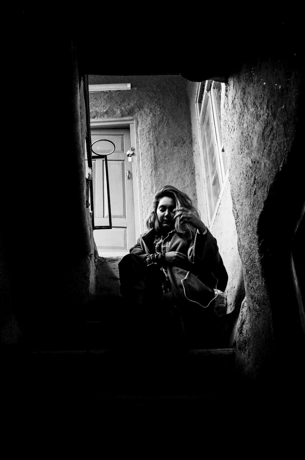 a person sitting in a doorway