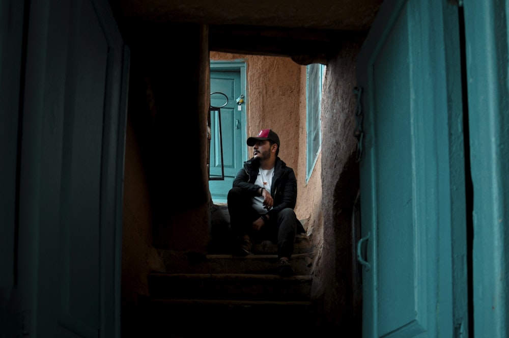 a man sitting on a staircase