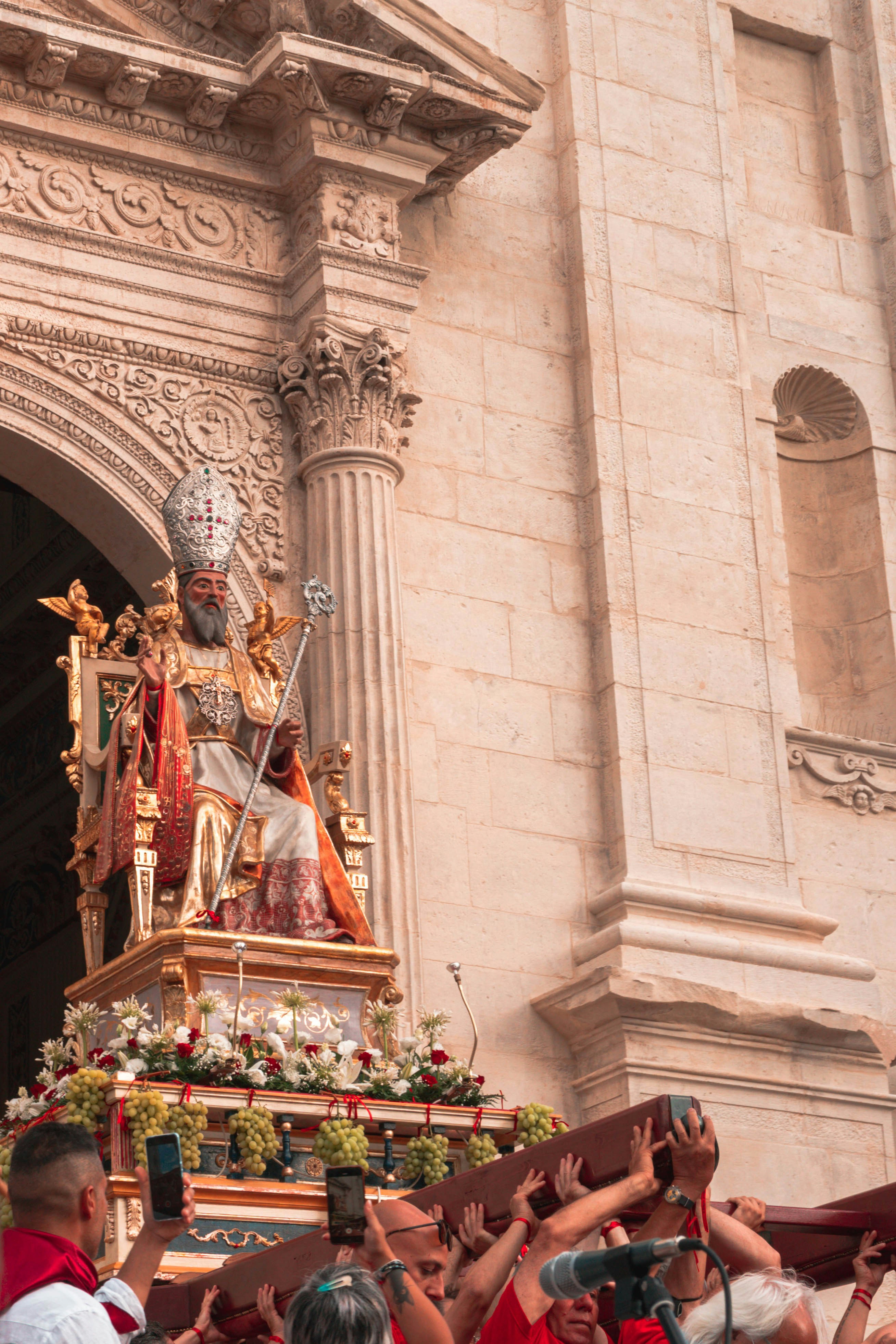 a statue of a person holding a staff