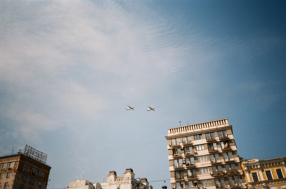 a couple of airplanes flying in the sky