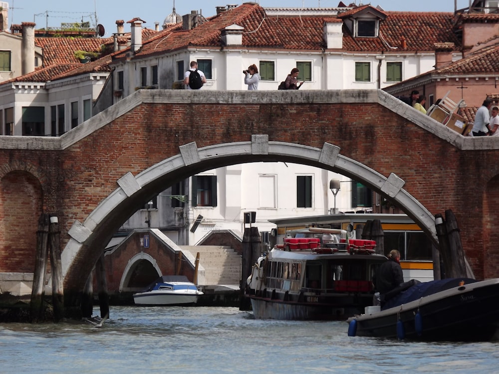 a bridge with a boat underneath