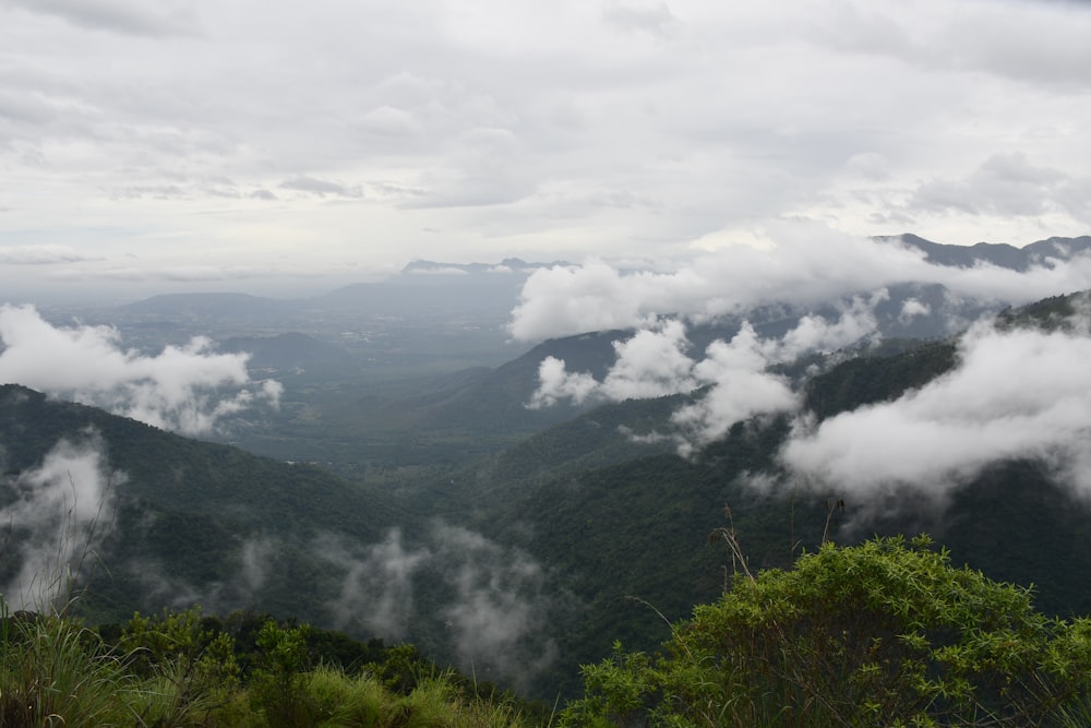 a view of a mountain range with clouds