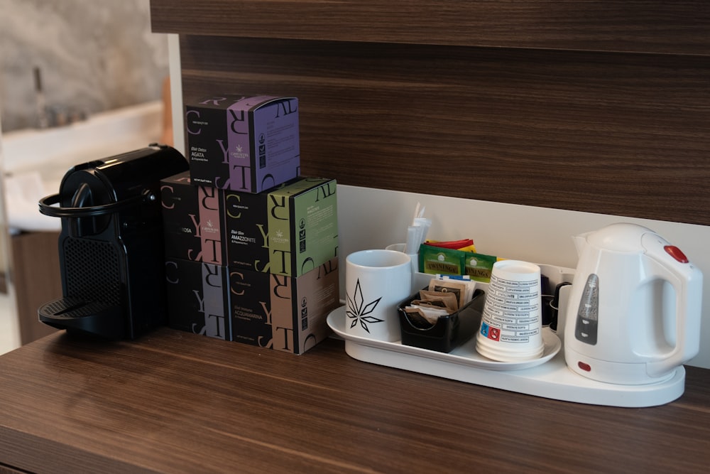a shelf with boxes and coffee cups