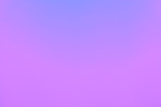 A vibrant gradient background transitions smoothly from purple to blue, creating a serene and abstract visual effect.