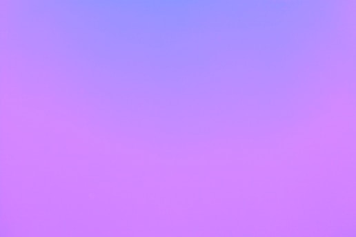 A vibrant purple gradient background with flowing, organic shapes and subtle microanimations reflecting a modern marketing vibe.