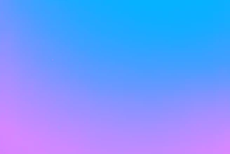 A minimalistic light pink screen showing the daily affirmation generator button with a gentle slide transition effect.