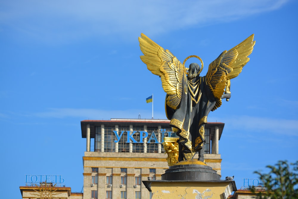 a statue of a dragon with wings