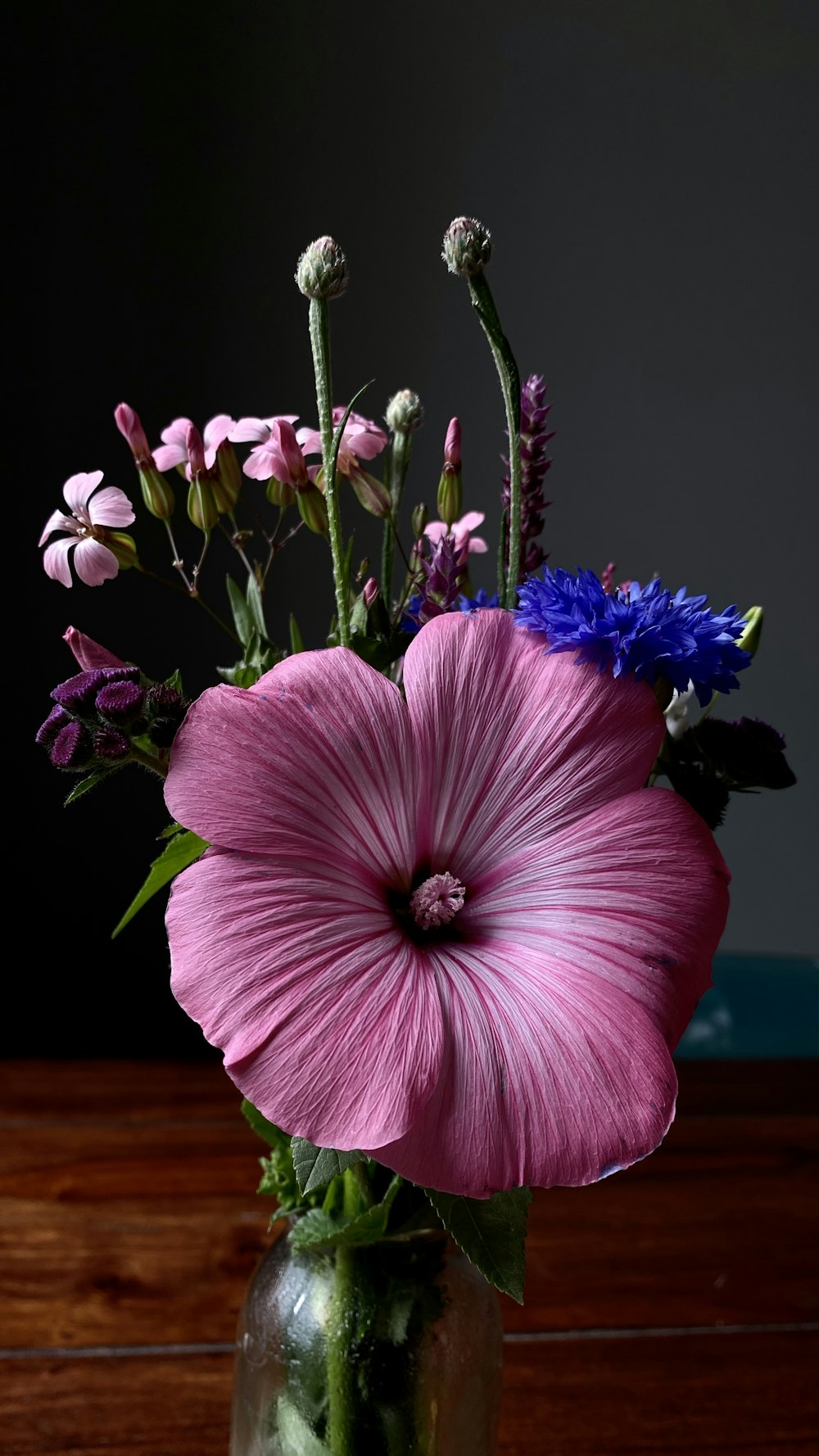 a vase with purple flowers