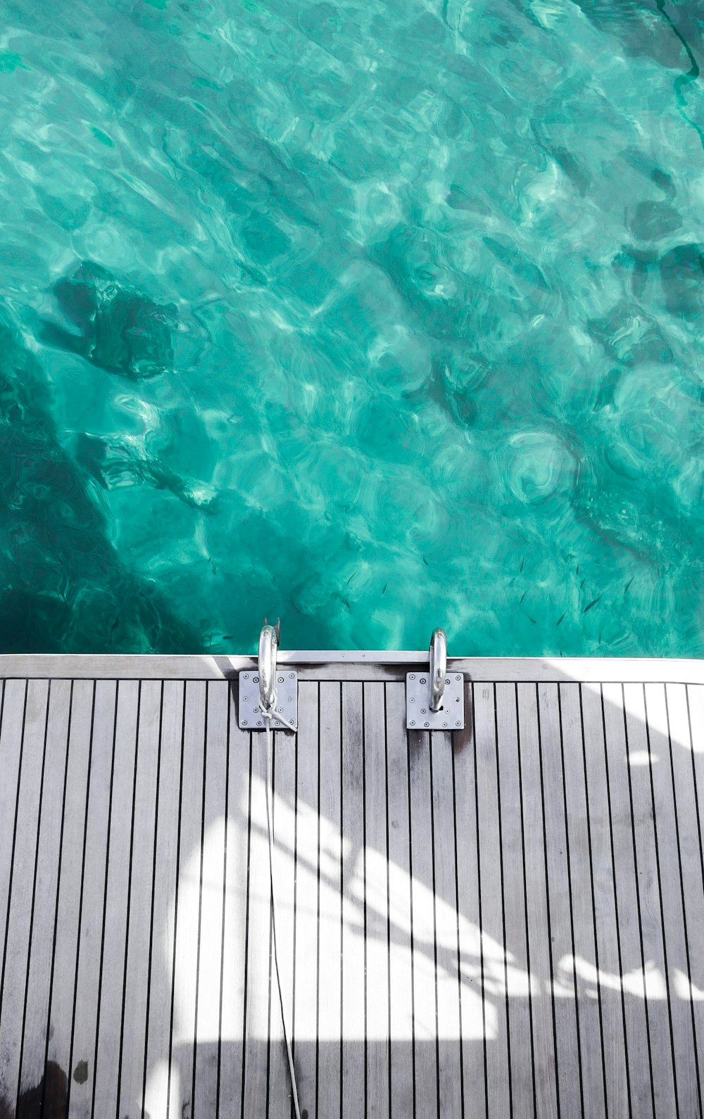 a deck with a pool of water