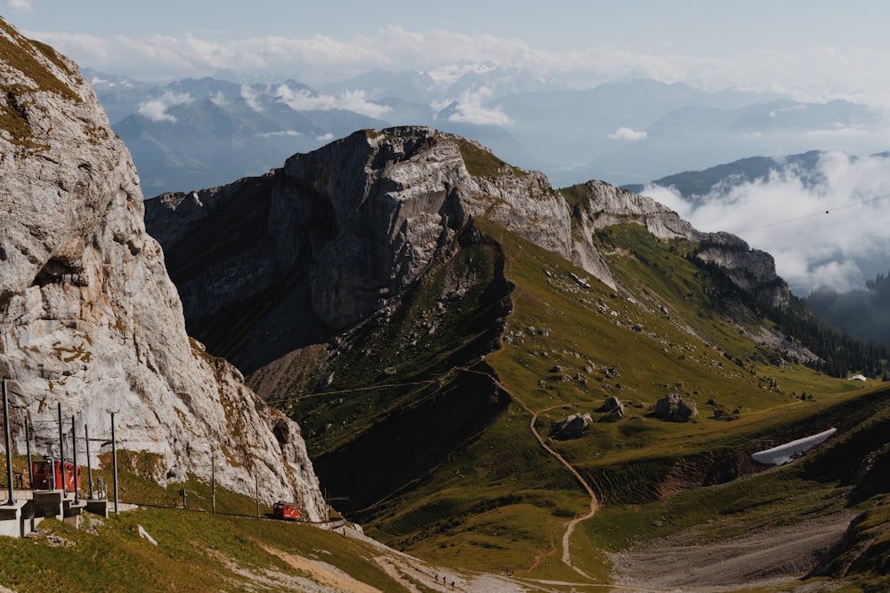 a road going through a valley between mountains