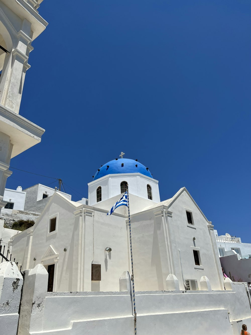 a white building with a blue dome