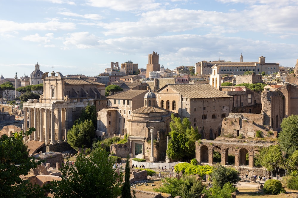 a large city with many buildings with Roman Forum in the background
