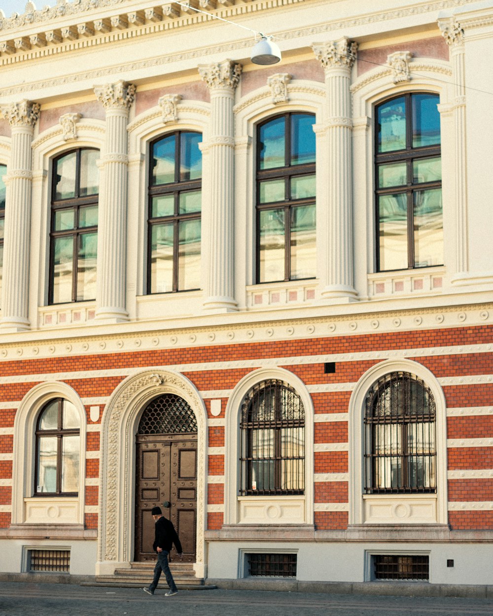 a person walking in front of a building