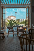 a patio with tables and chairs