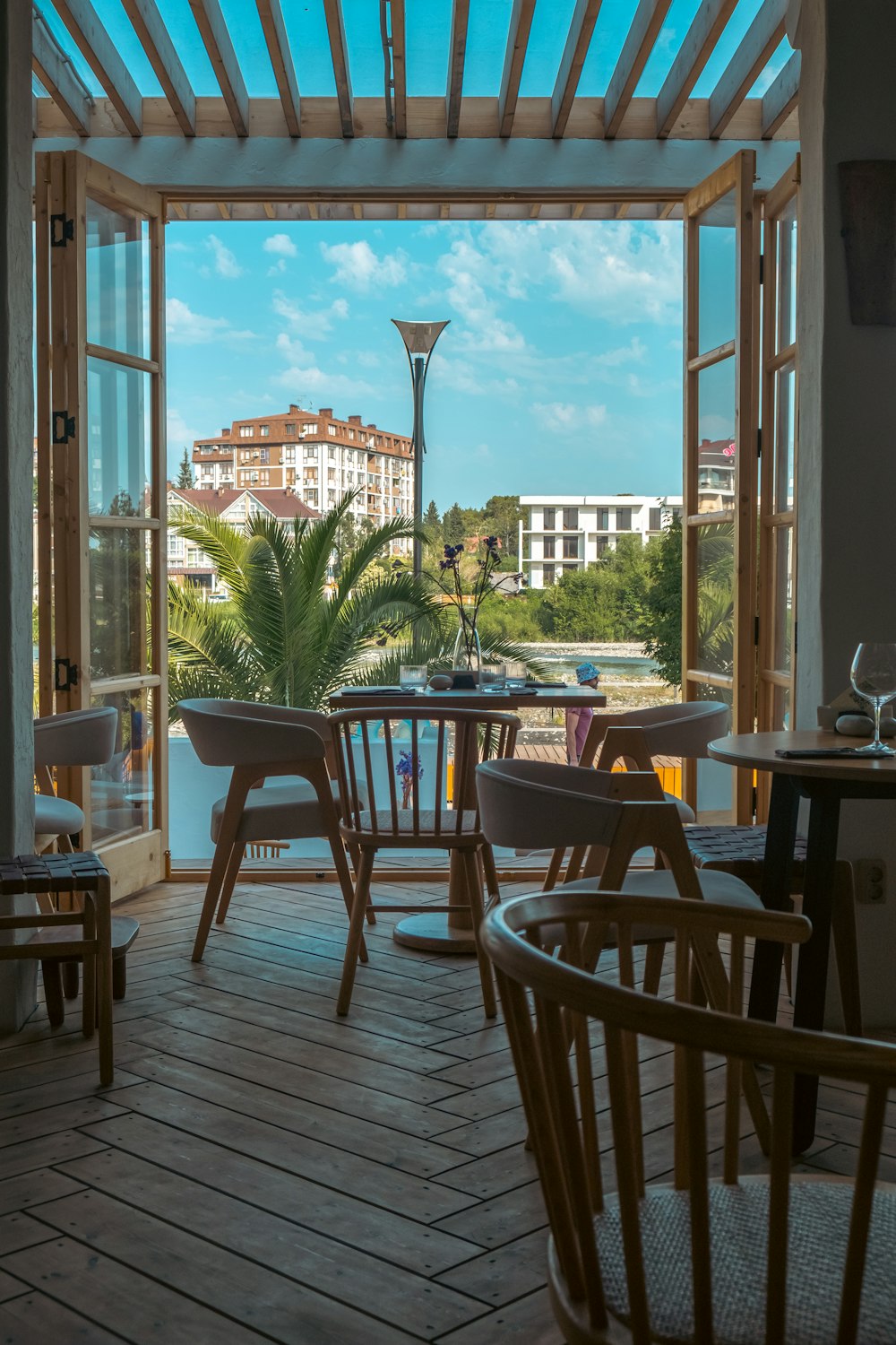 a patio with tables and chairs