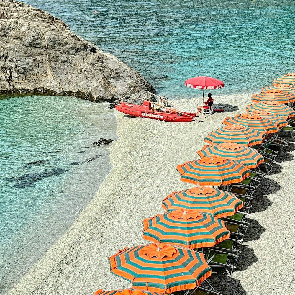 a beach is filled with umbrellas