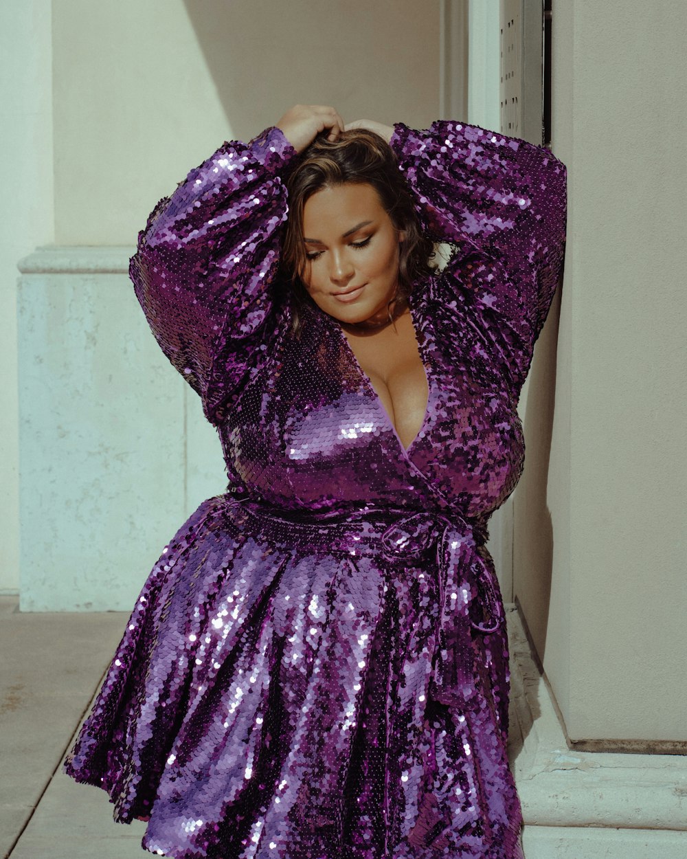 a woman wearing a purple dress