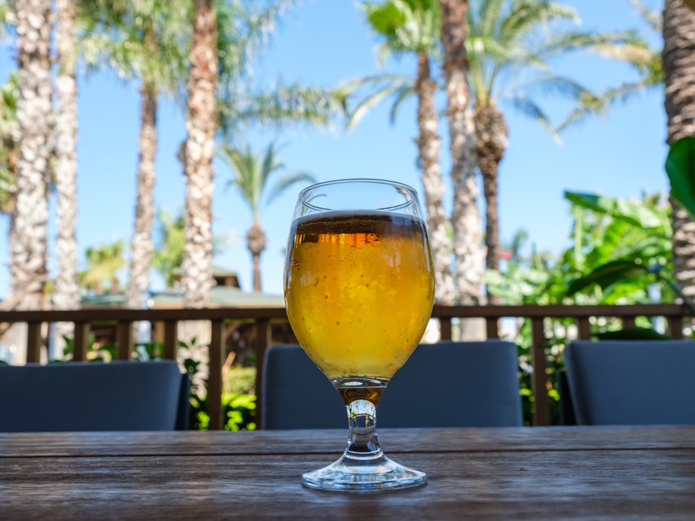 a glass of beer on a table