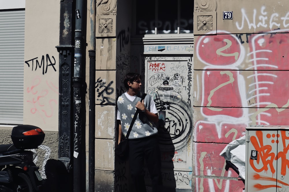 a person standing next to a building