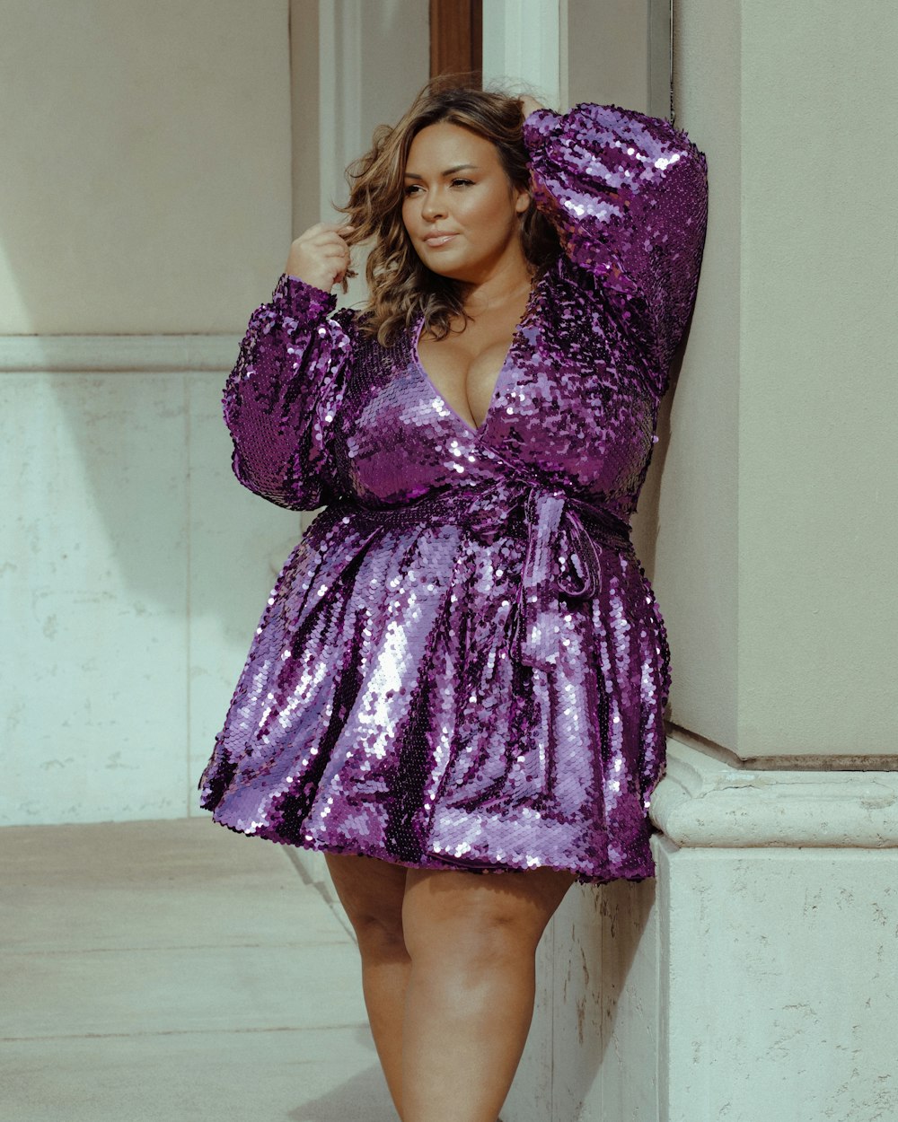 a woman wearing a purple dress